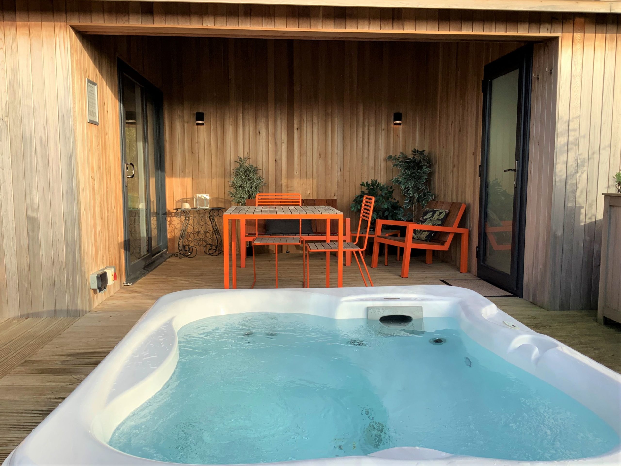 Beautiful decked area and sunken hot tub at Deer Leap