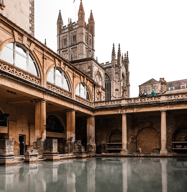 old temple facade reflecting in roman baths